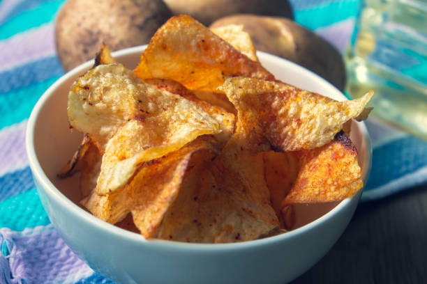 istock Close view of spicy potato chips in a bowl 1214698147