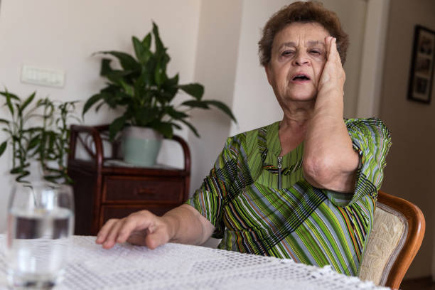 istock Woman having headache migraine 1214699102
