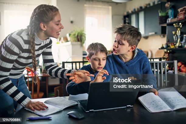 Three Kids Fighting For Laptop At Home Stock Photo - Download Image Now - Arguing, Child, Family