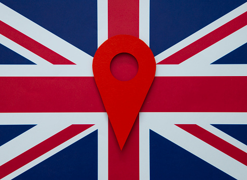 Red map pointer on the British Flag