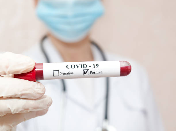 istock Nurse holding test tube with blood for 2019-nCoV analyzing 1214702509