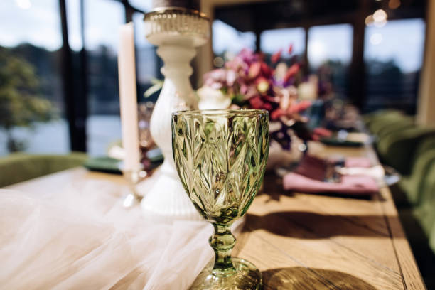 istock Green drink glass on wedding table in restaurant 1214703746