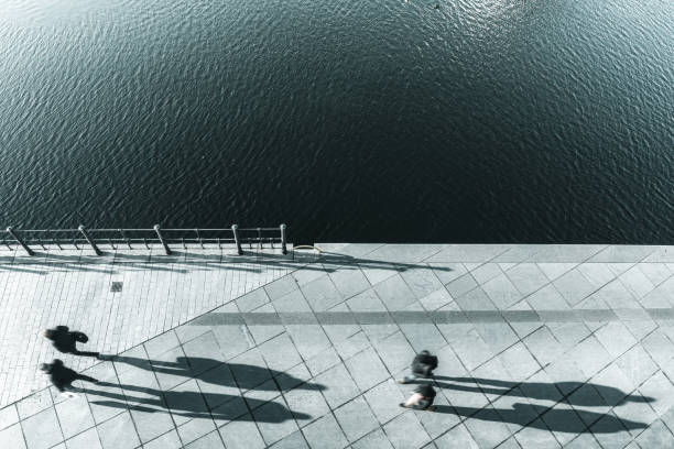 istock pedestrians walking along the river in Berlin 1214704115