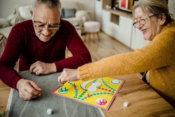 istock An older couple plays board games 1214704797