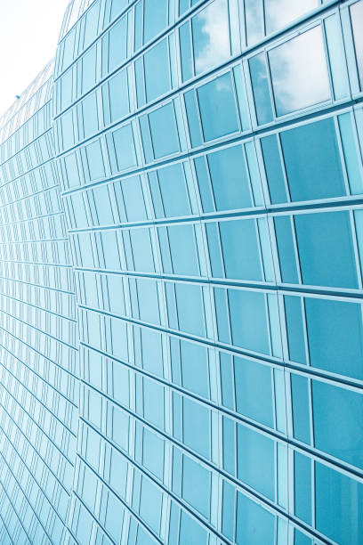 istock underside panoramic and perspective view to steel blue glass high rise building skyscrapers, business concept of successful industrial architecture 1214706439