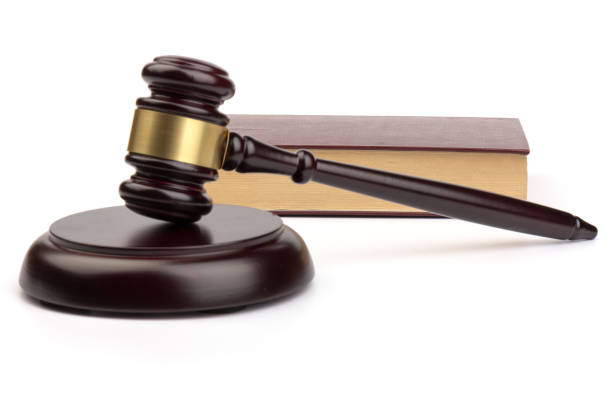 istock Wooden judges gavel on white background in close up. Space for text 1214708217