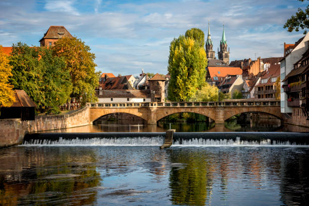 One of the most beautiful bridges in Nuremberg. View along the Pegnitz river from Max Brucke bridge to Schlayer Tower Bridge and Nuremberg Bavaria Germany EU Sebald historic district