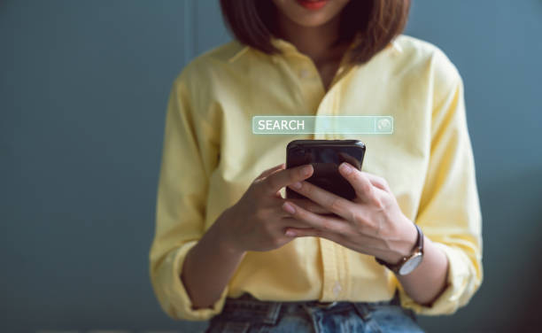 istock Woman using smartphones and searching browsing Internet button on virtual on screen mobile. 1214710801