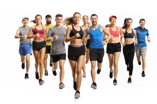 Full length portrait shot of many young and older people running in sportswear isolated on white background