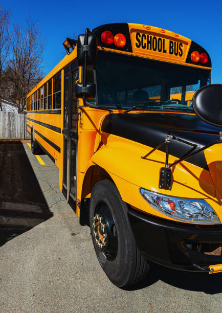 istock School Bus in Parking Lot 1214711158