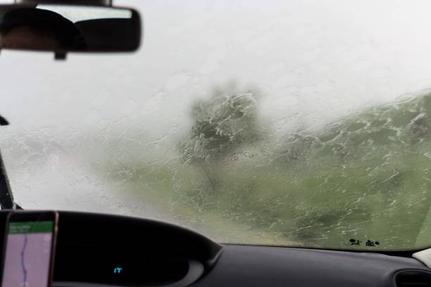 istock Driving the car through rain 1214711743