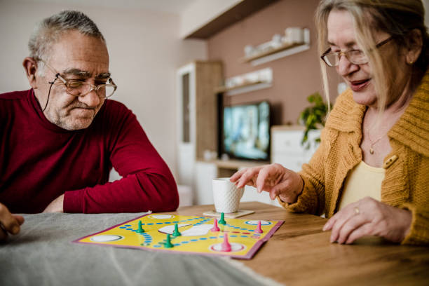 istock An older couple plays board games 1214711768