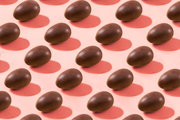 istock Chocolate Eggs in a Row on Pink Background 1214711959