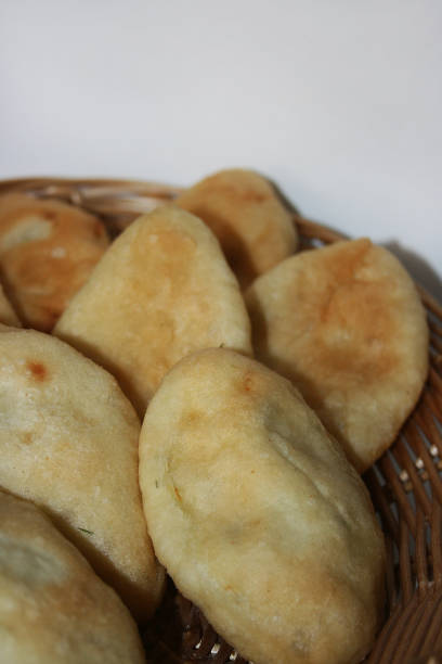istock the baked potato pies on the white background 1214713986