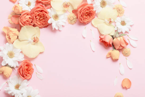 istock beautiful floral pattern on pink paper background 1214714387