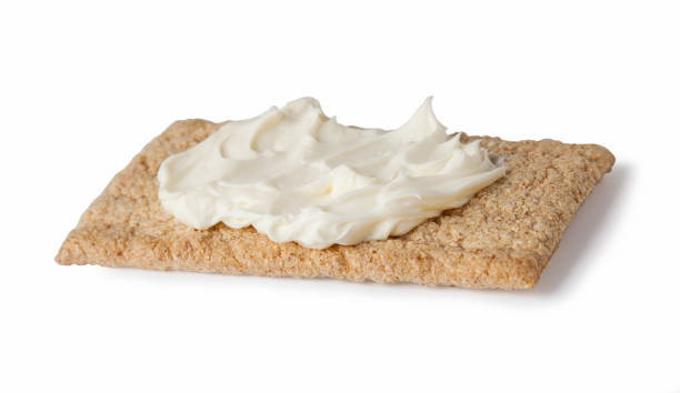 istock crispreads slices with cream cheese, isolated on white background 1214714505