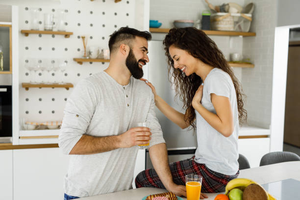 istock Young couple having a relaxing breakfast together at home 1214716118