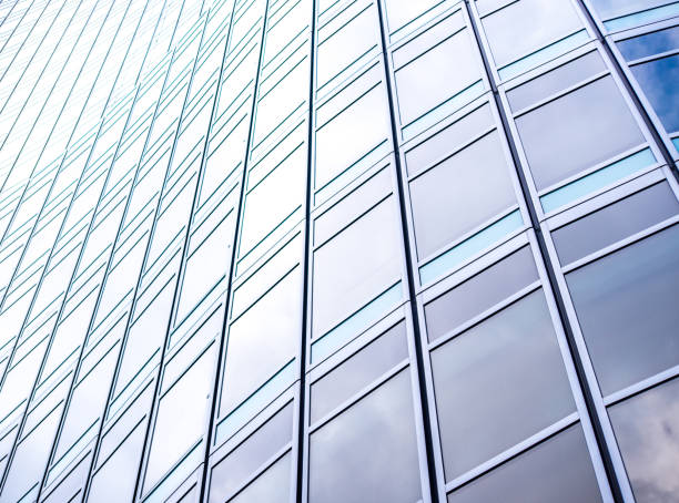 istock underside panoramic and perspective view to steel blue glass high rise building skyscrapers, business concept of successful industrial architecture 1214716421