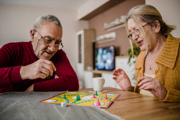 istock An older couple plays board games 1214716516