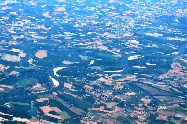 istock Italian landscape with river seen from an airplane 1214717444