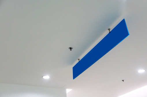 Blank blue advertising ceiling Promotional Advertising dangler for design presentation. Directional sign.