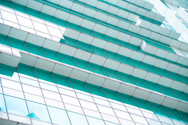 istock underside panoramic and perspective view to steel blue glass high rise building skyscrapers, business concept of successful industrial architecture 1214721187