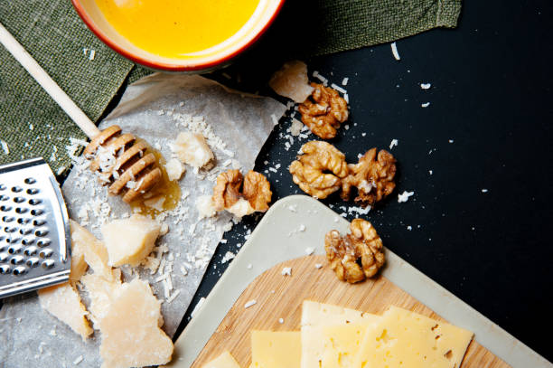 istock Grated parmesan cheese background rustic food. 1214721334