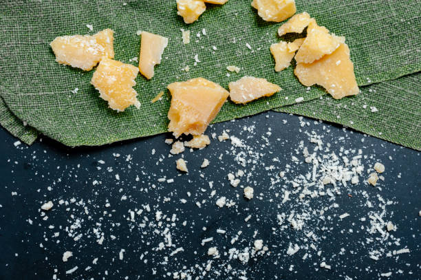 istock Grated parmesan cheese background rustic food. 1214721371