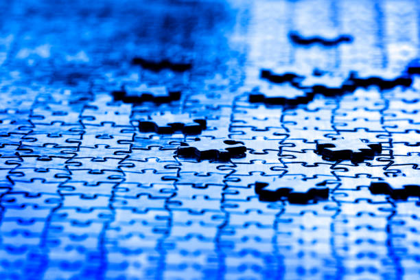 istock Puzzle pieces on table solving a game for fun and achievement jigsaw 1214721770