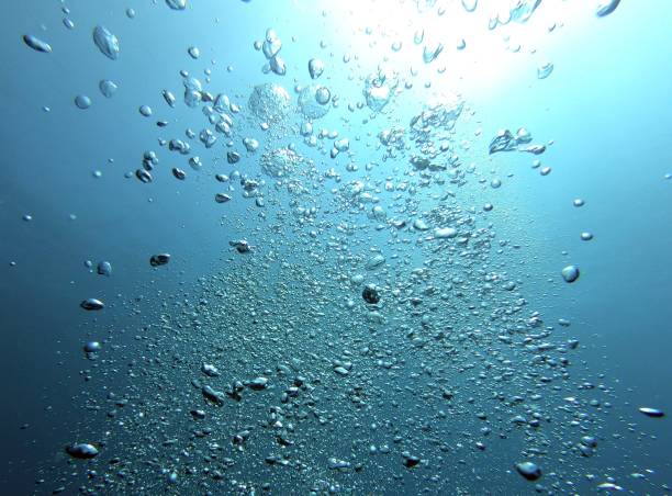 istock Bubble in the Blue Sea Underwater Ambiance, Sun light beams 1214721775