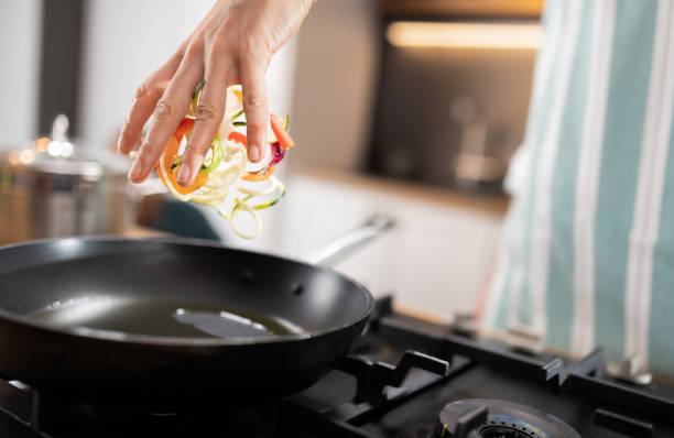istock Professional Chef Tossing Food 1214723373
