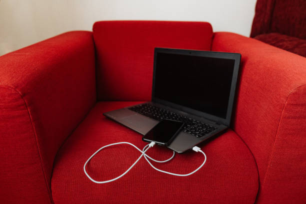 istock The smartphone is charging from the laptop 1214723724