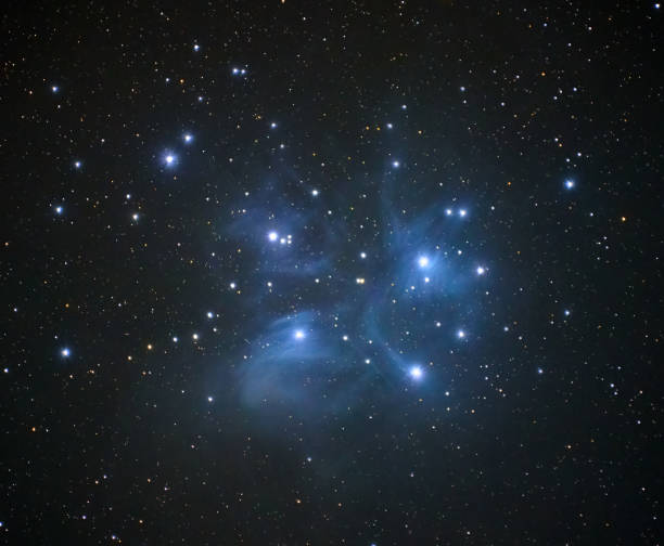 Pleiades constellation and nebula Pleiades constellation and star cluster with oxygen III nebula around the pleiades stock pictures, royalty-free photos & images