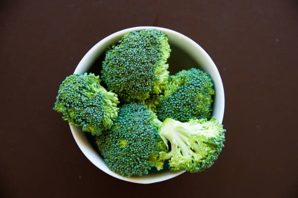 istock Raw broccoli background. Healthy food, diet concept. Top view 1214725440