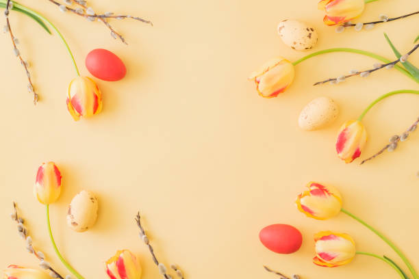 istock Flat lay easter composition with yellow tulips and eggs on a yellow background 1214726933