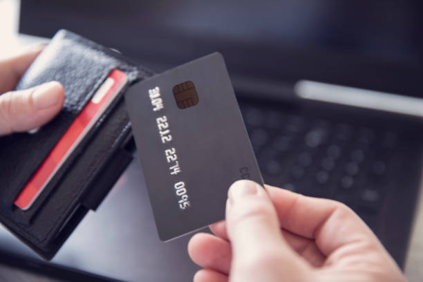 istock Man is Shopping Online with Credit Card 1214727165