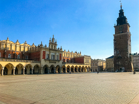 The Old Town Square in Cracow with the Town Hall Tower and Cloth Hall, Poland.