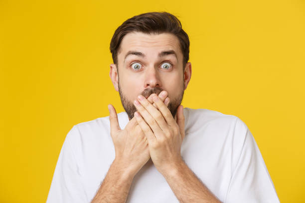 istock young bearded man looking amazed in to the camera 1214728903