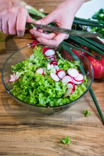 istock fresh salad with radishes, lettuce and onions 1214729824
