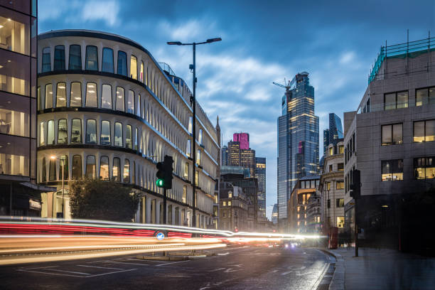 istock Evening illumination in London city during rush hour - creative stock image 1214729891