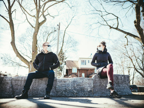 istock COVID-19, Young couple meeting outside 1214730557