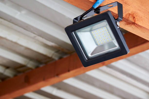 istock LED flood light, spot light on the top of the roof 1214731027