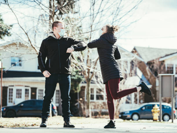 istock COVID-19, Young couple meeting outside 1214731081