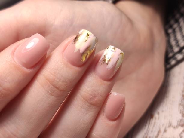 istock stylish design of manicure on beautiful nails 1214731889