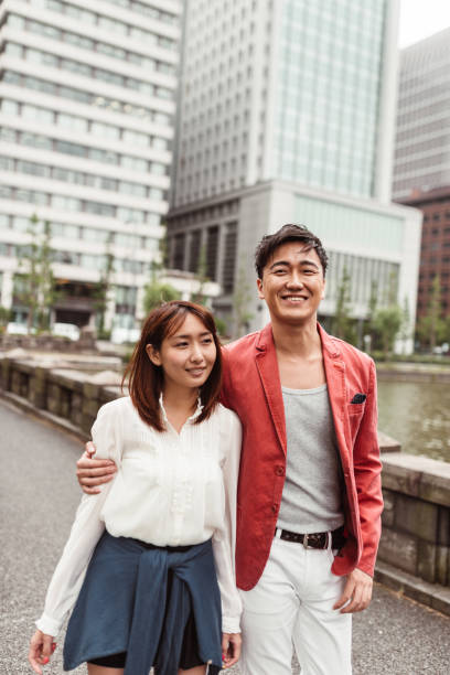 istock couple happiness walking in Tokyo 1214731966