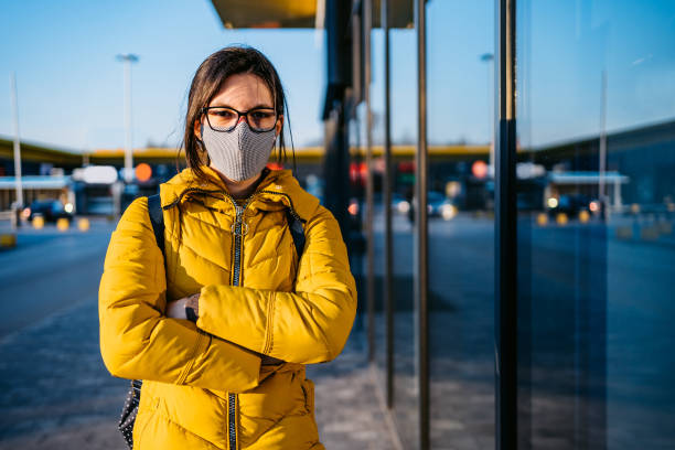 istock Woman in shopping mall with face mask 1214731987