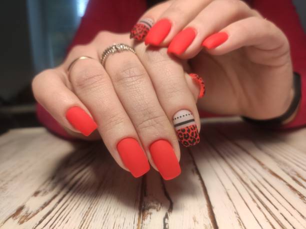 istock stylish design of manicure on beautiful nails 1214732055