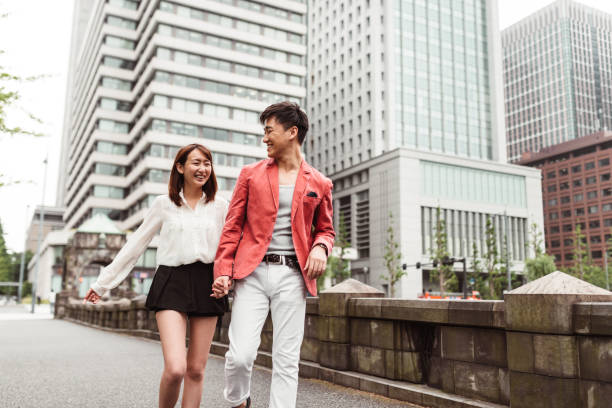 istock couple happiness walking in Tokyo 1214734066