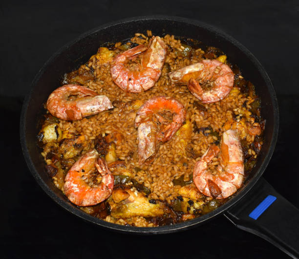 istock Cooking a plate of rice (Paella) 1214734213