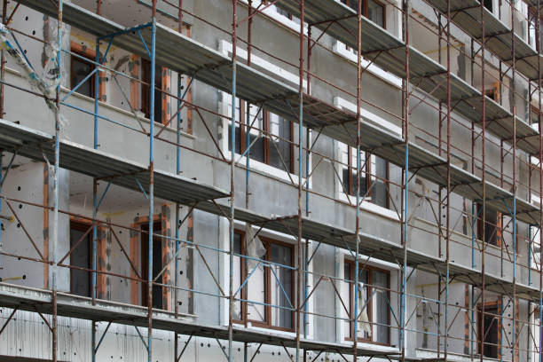 The process of renovating a new building. New construction, exterior wall insulation The process of renovating a new building. New construction, exterior wall insulation. pomorie stock pictures, royalty-free photos & images